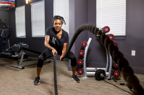 girl with battle ropes at evolve community new workout