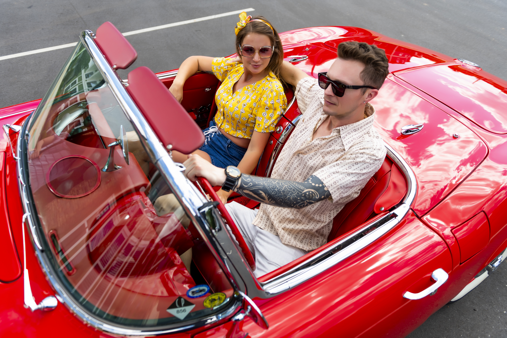 evolve-companies-blog-road-trip-spots-people-in-red-car people in red car evolve companies blog