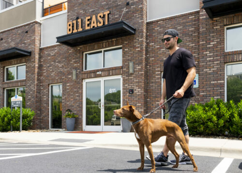 guy with dog outside 811 east road trip spots