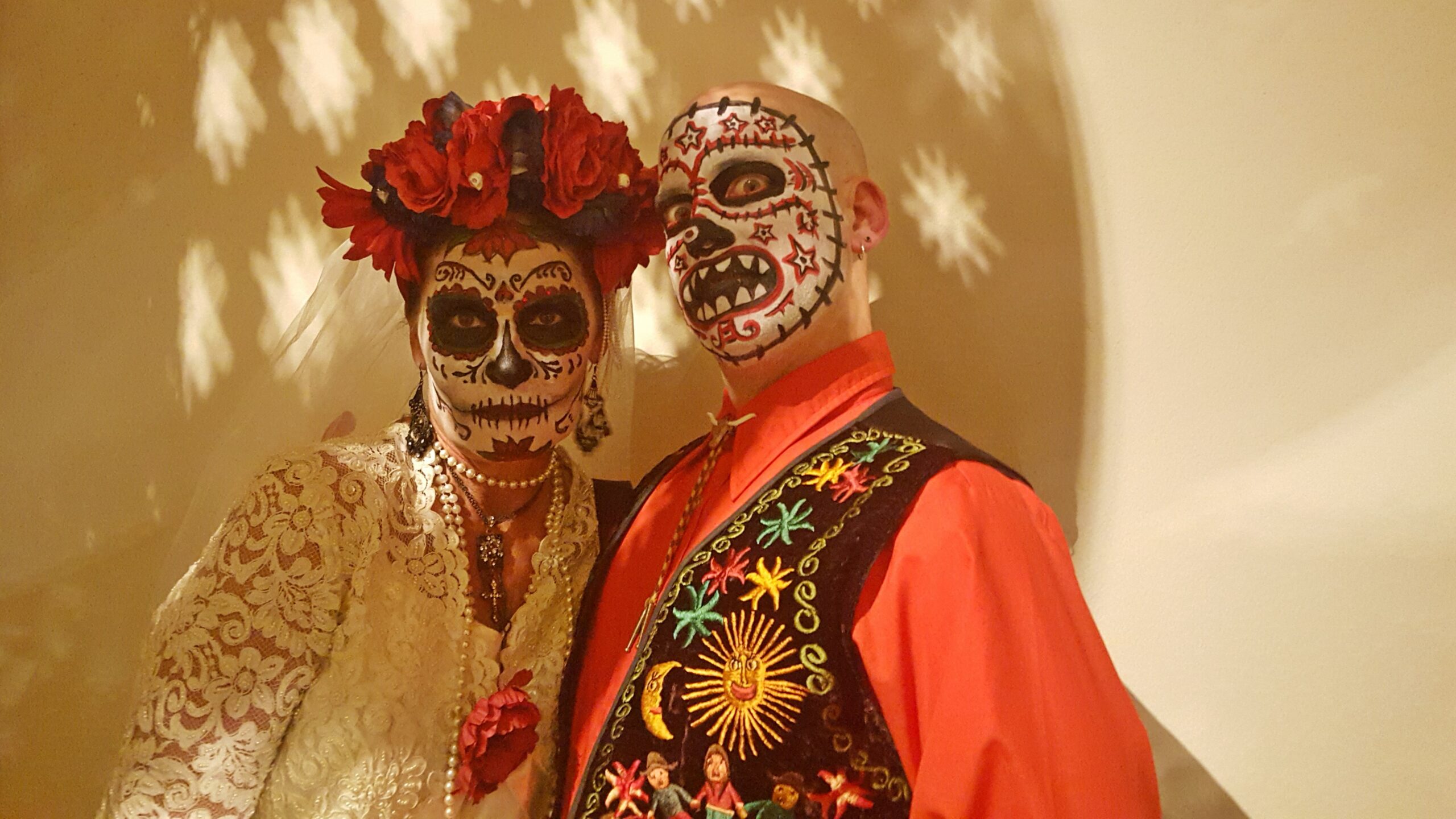 evolve-blog-halloween-costume-contest people with sugar skull face paint celebrating halloween evolve blog