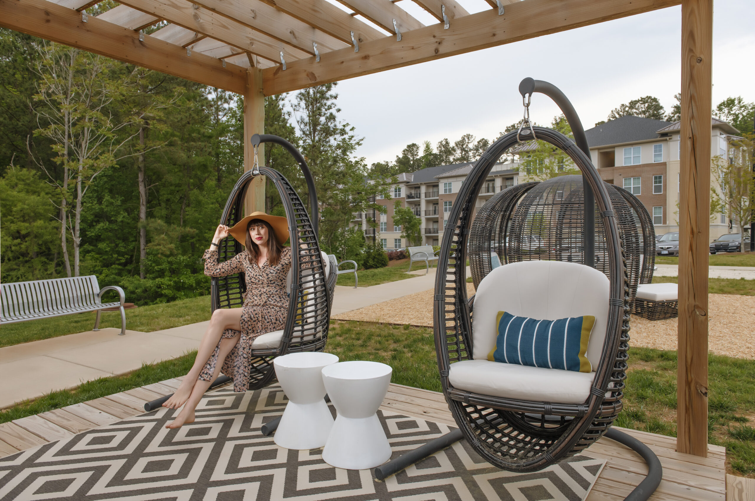 girl sitting in egg chair outdoors at evolve