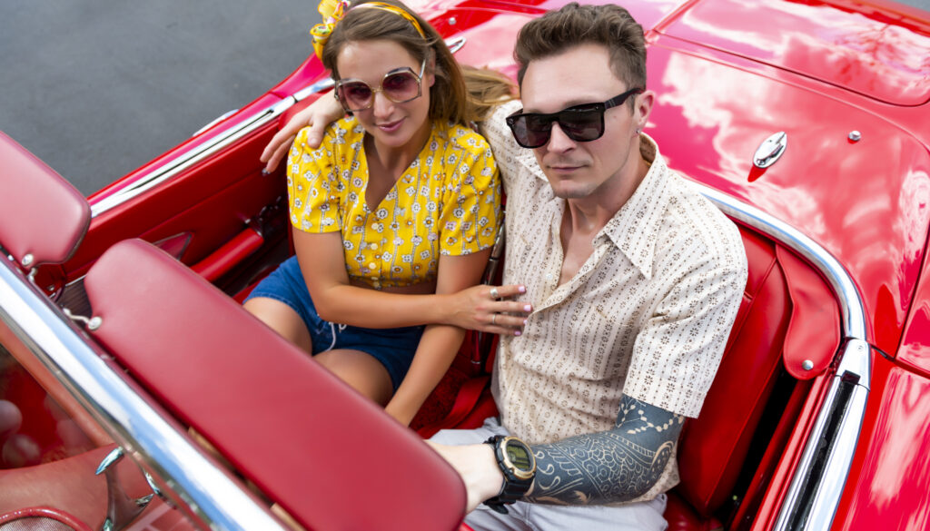 evolve staycation blog people in red convertible