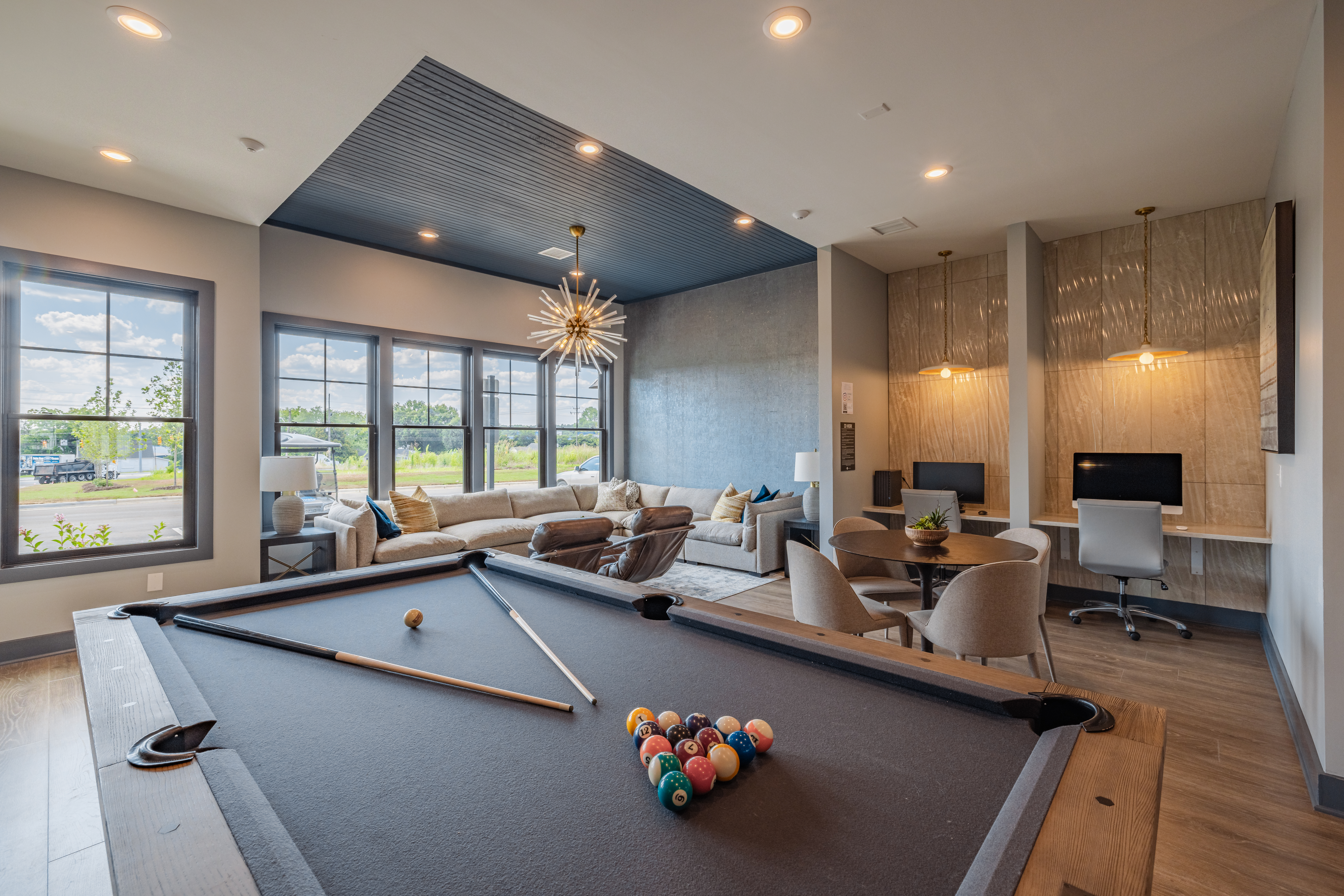 billiard table and business center at evolve at parkway
